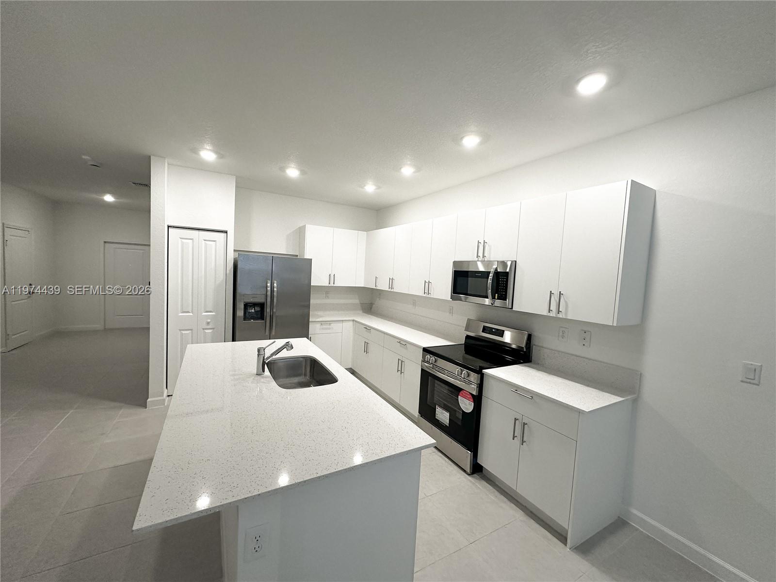 14804 Southwest 162nd Street Miami, FL 33177 - Photo 5 of 22 a kitchen with stainless steel appliances a refrigerator and a sink