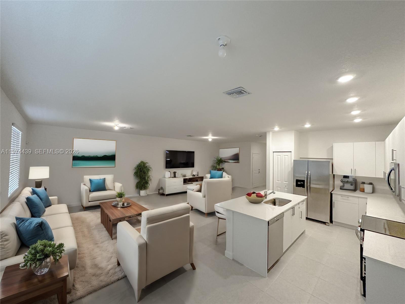 14804 Southwest 162nd Street Miami, FL 33177 - Photo 7 of 22 a living room with fireplace furniture and a view of kitchen