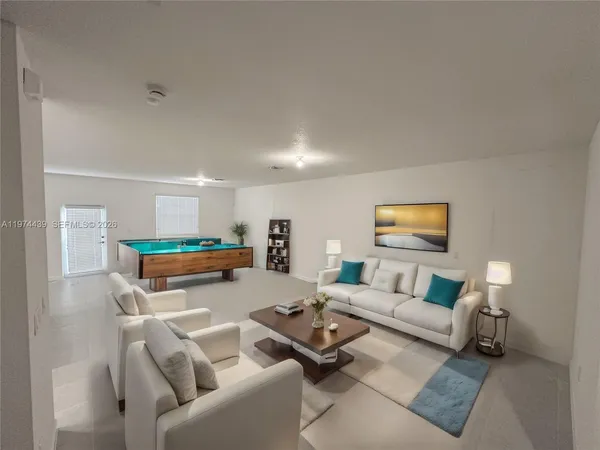 a living room with furniture and a table