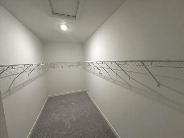 a view of a room with racks on the wall