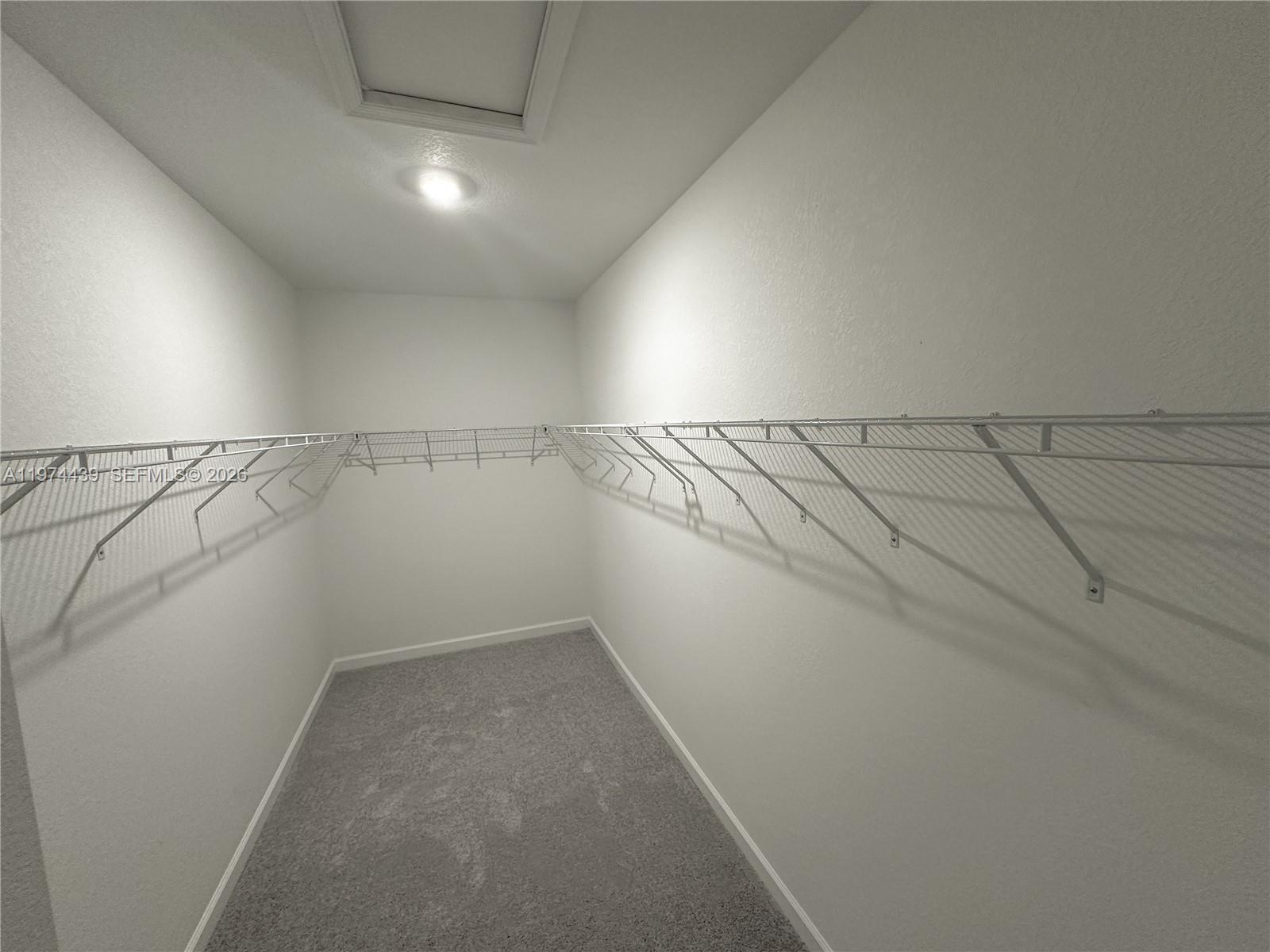 14804 Southwest 162nd Street Miami, FL 33177 - Photo 10 of 22 a view of a room with racks on the wall