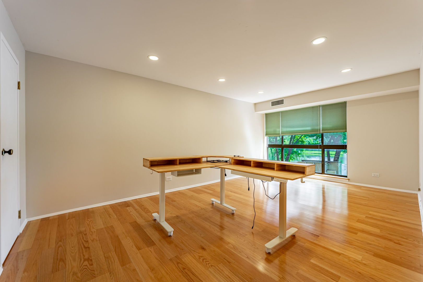 701 Forum Square, Unit 101 Glenview, IL 60025 - Photo 12 of 42 a view of a room with wooden floor and large window