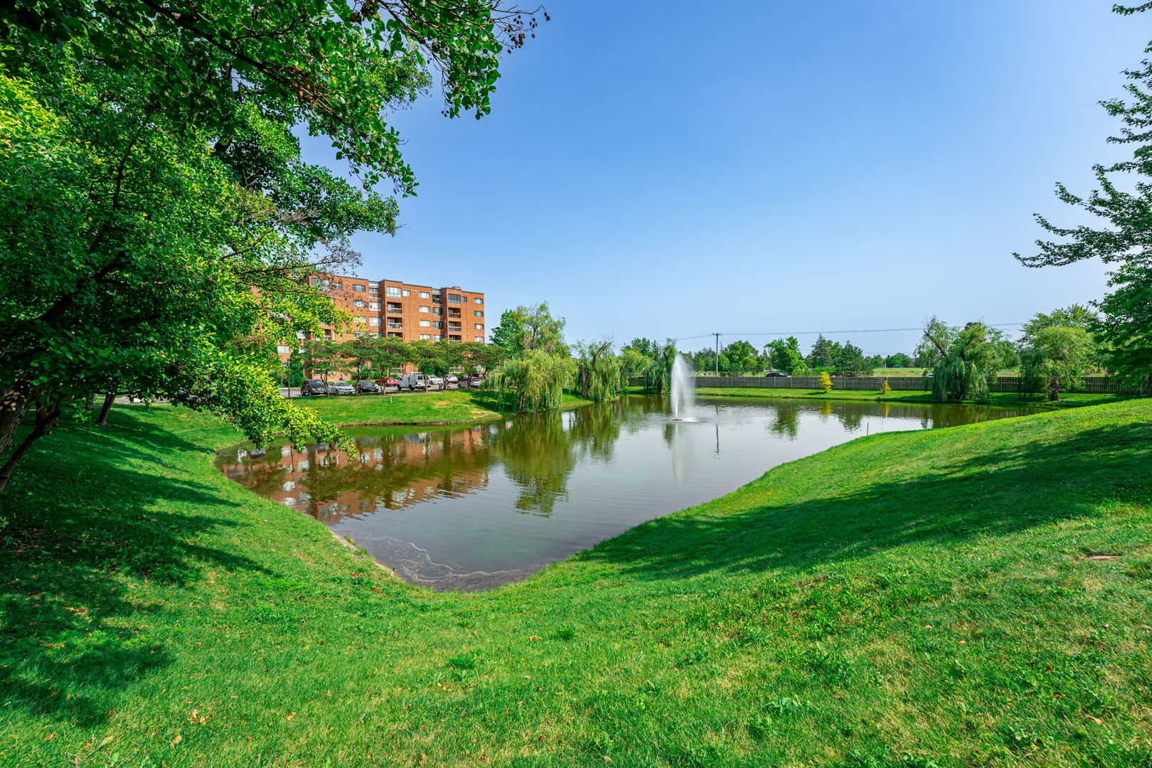 701 Forum Square, Unit 101 Glenview, IL 60025 - Photo 26 of 42 a view of a lake with houses in the back