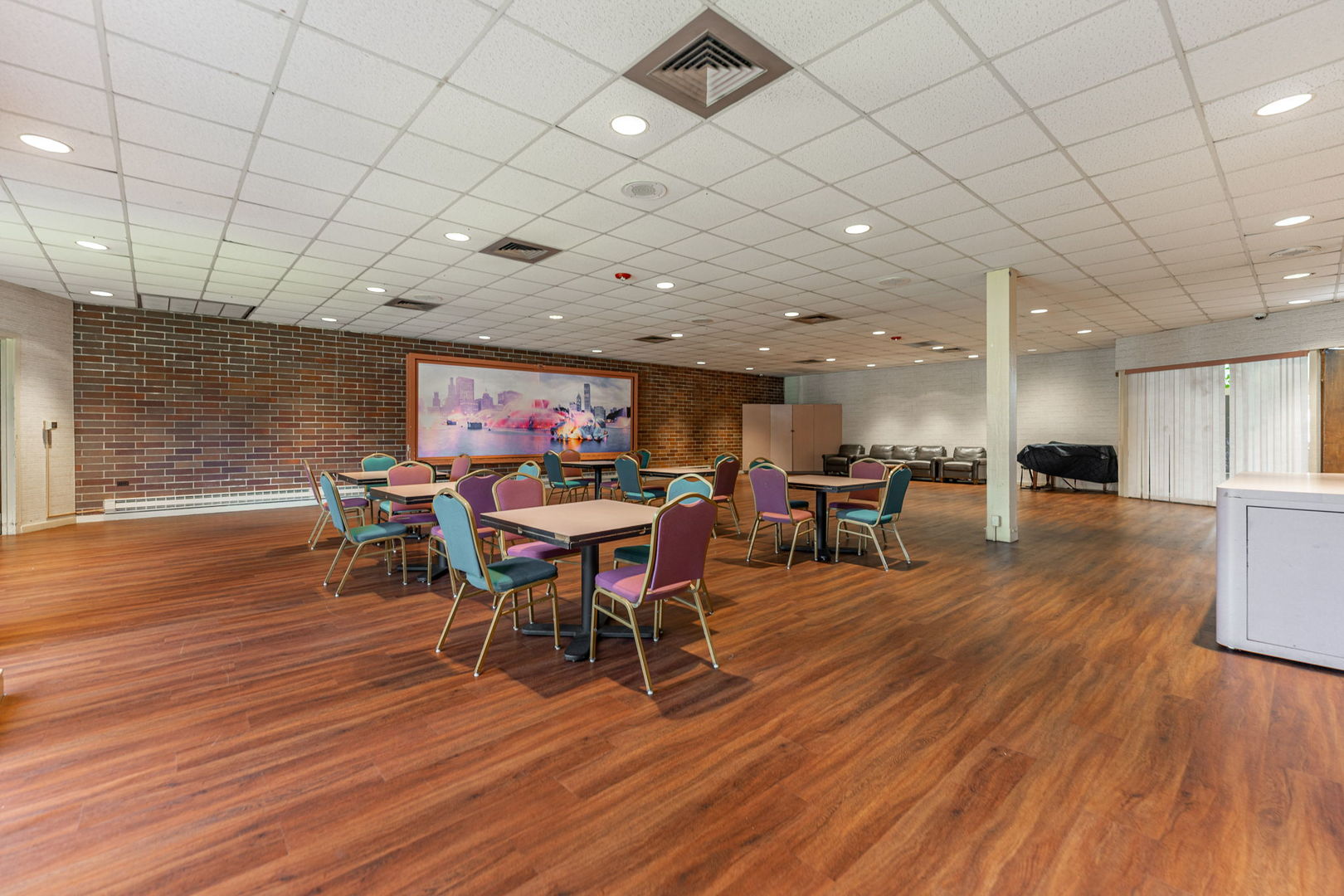 701 Forum Square, Unit 101 Glenview, IL 60025 - Photo 35 of 42 a view of a dining room with furniture and wooden floor