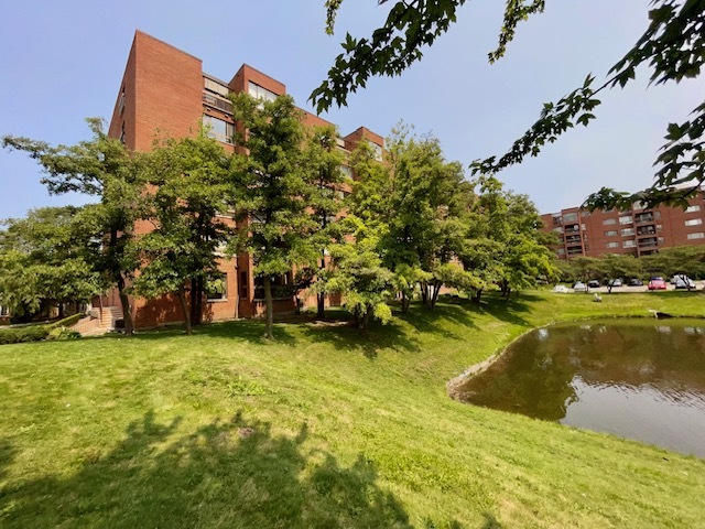 701 Forum Square, Unit 101 Glenview, IL 60025 - Photo 42 of 42 a swimming pool with trees in the background