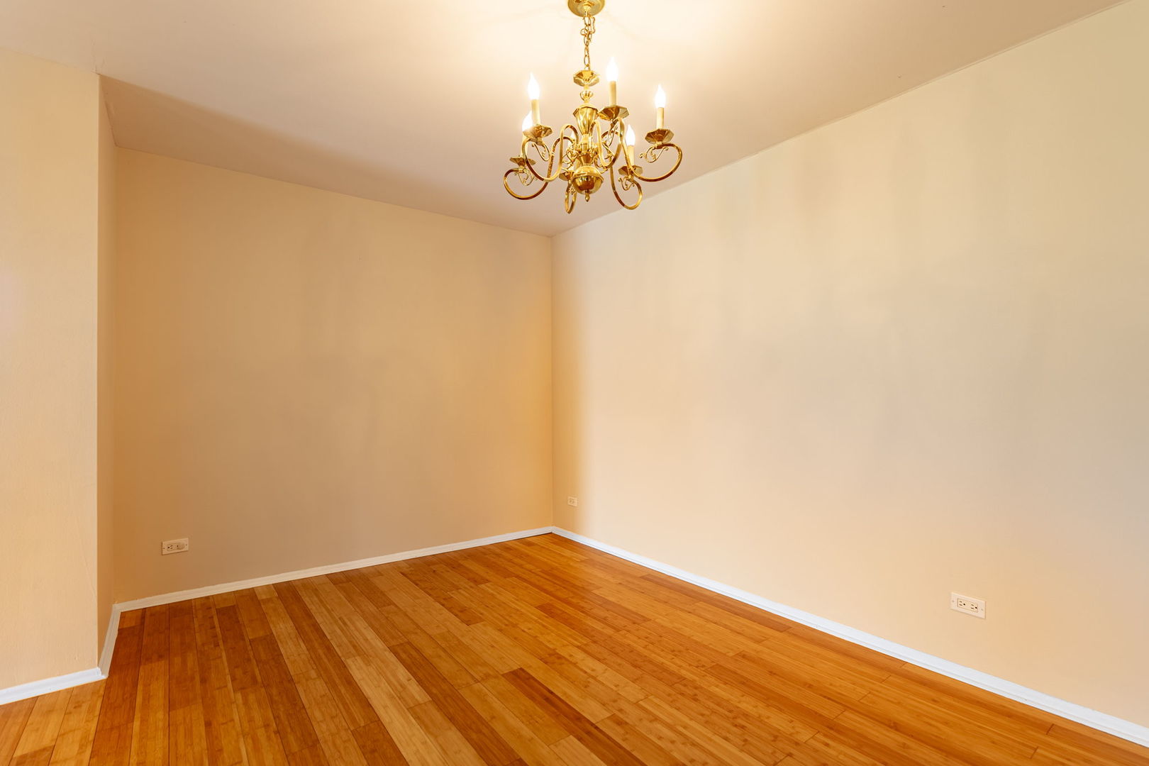 701 Forum Square, Unit 101 Glenview, IL 60025 - Photo 6 of 42 a view of a room with wooden floor and chandelier