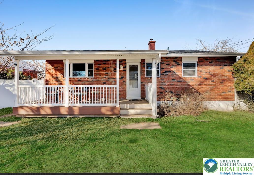 856 Poplar Road Hellertown, PA 18055 - Photo 16 of 19 a front view of a house with garden