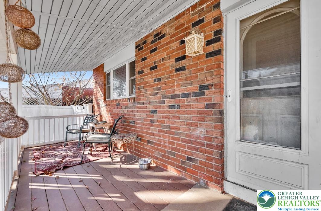 856 Poplar Road Hellertown, PA 18055 - Photo 17 of 19 a view of a patio with table and chairs with wooden floor