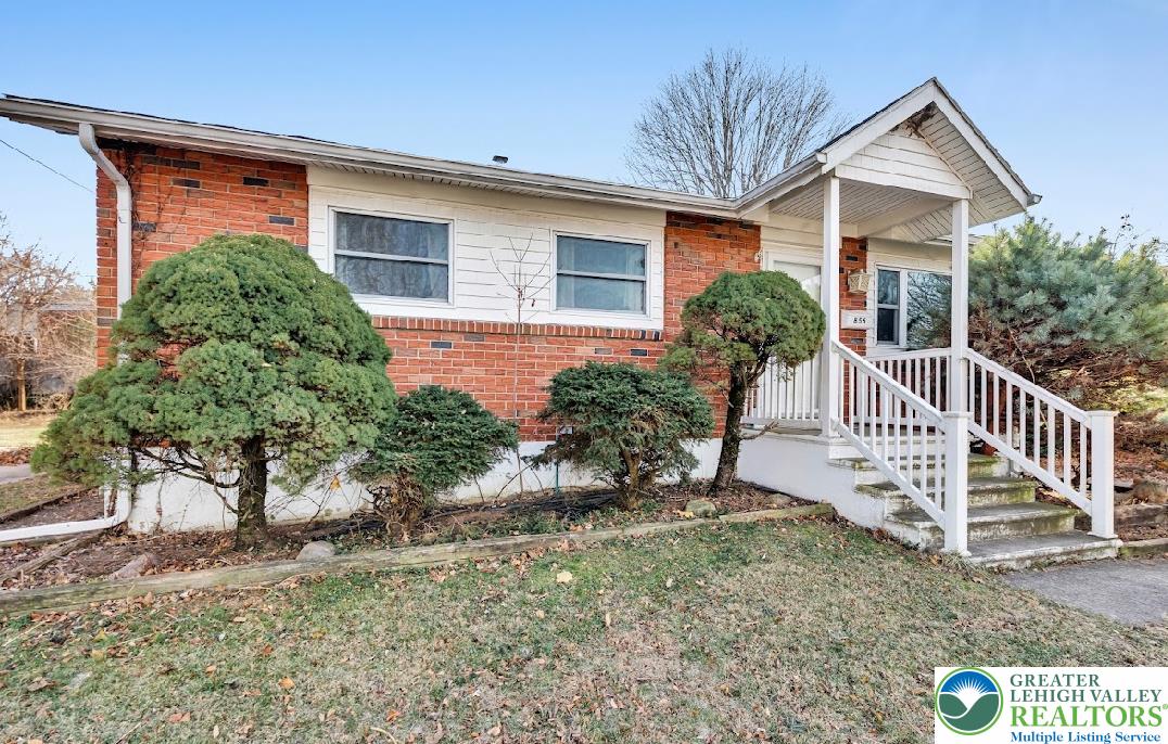856 Poplar Road Hellertown, PA 18055 - Photo 2 of 19 a front view of a house with a yard