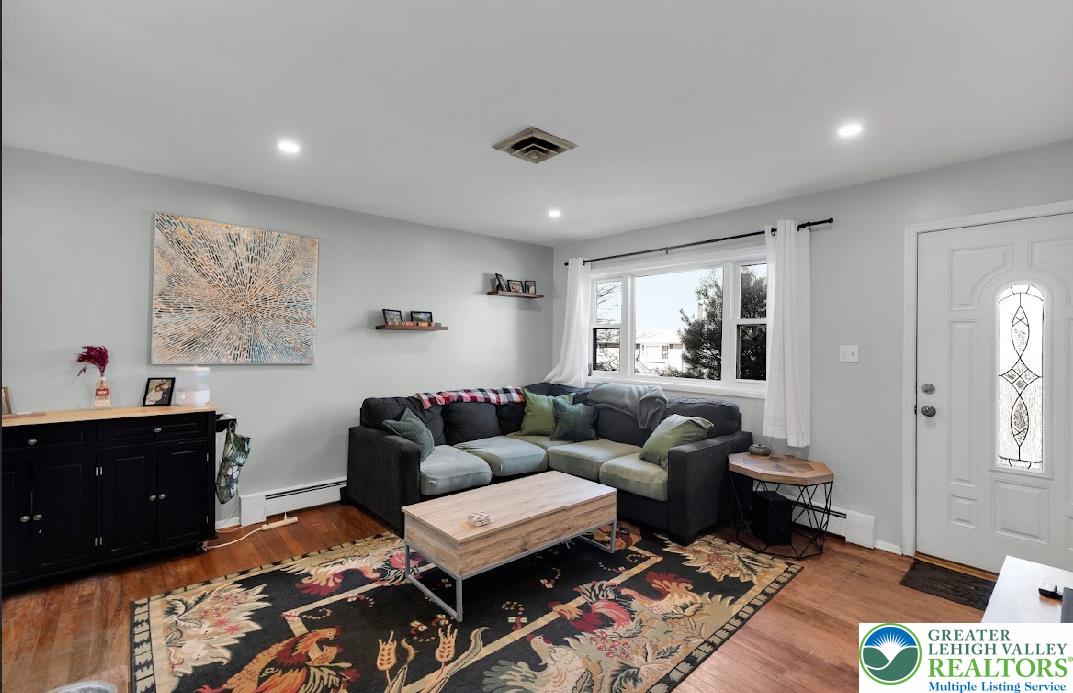 856 Poplar Road Hellertown, PA 18055 - Photo 3 of 19 a living room with furniture and wooden floor