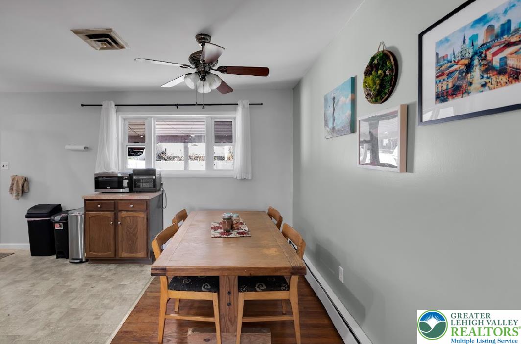 856 Poplar Road Hellertown, PA 18055 - Photo 5 of 19 a view of a dining room with furniture window and wooden floor