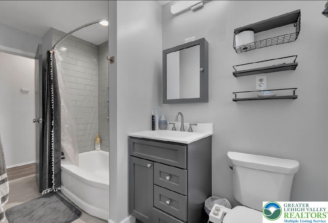 856 Poplar Road Hellertown, PA 18055 - Photo 9 of 19 a bathroom with a sink a toilet and shower