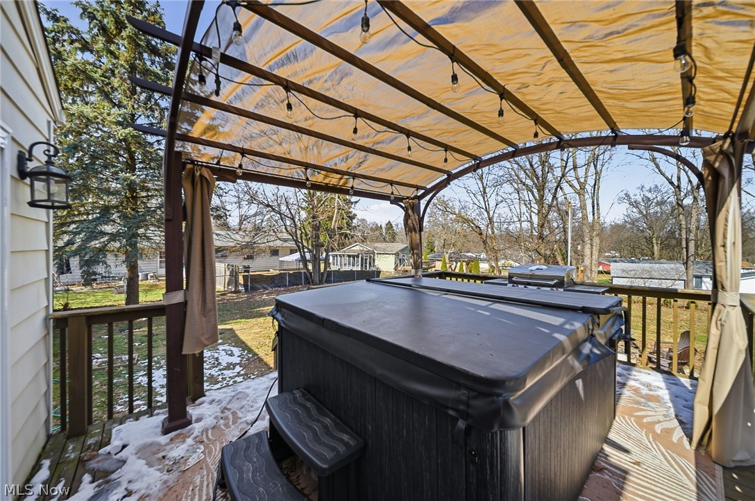 3905 Kent Road Stow, OH 44224 - Photo 41 of 45 Wooden deck featuring a hot tub