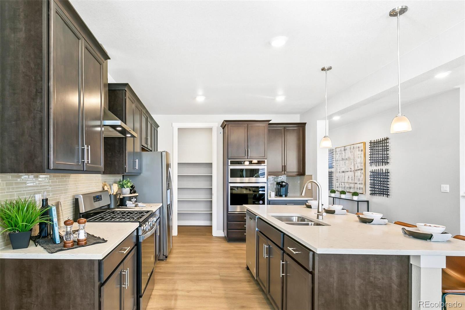 1908 Chaffee Crest Drive Berthoud, CO 80513 - Photo 11 of 39 a kitchen with a sink stove and refrigerator
