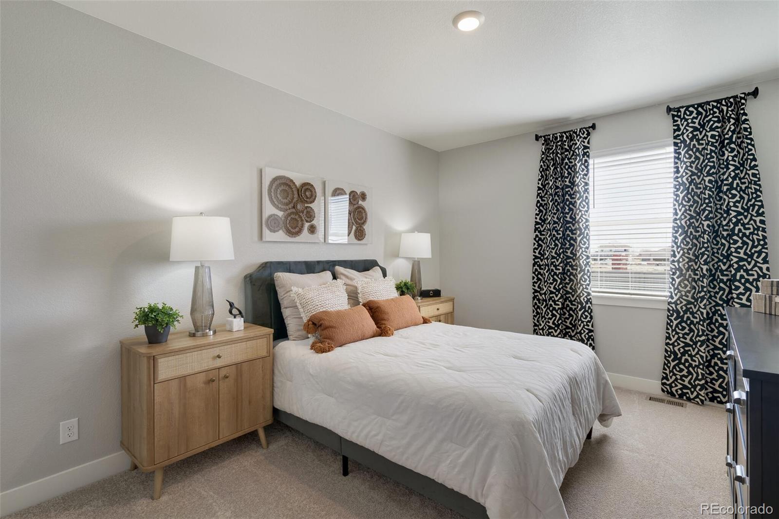1908 Chaffee Crest Drive Berthoud, CO 80513 - Photo 16 of 39 a bedroom with a bed and a window