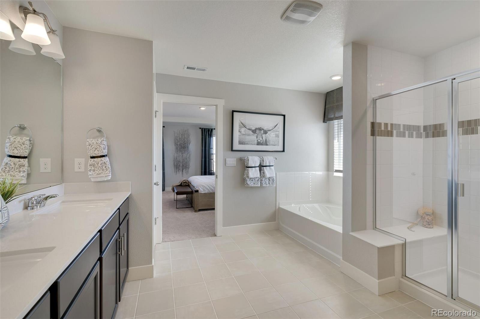 1908 Chaffee Crest Drive Berthoud, CO 80513 - Photo 21 of 39 a bathroom with a tub sink and mirror