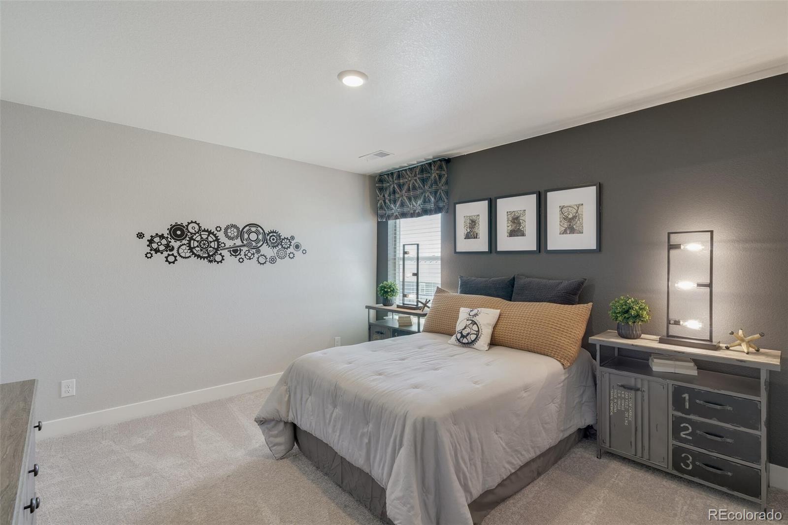 1908 Chaffee Crest Drive Berthoud, CO 80513 - Photo 24 of 39 a bedroom with a bed and cabinet