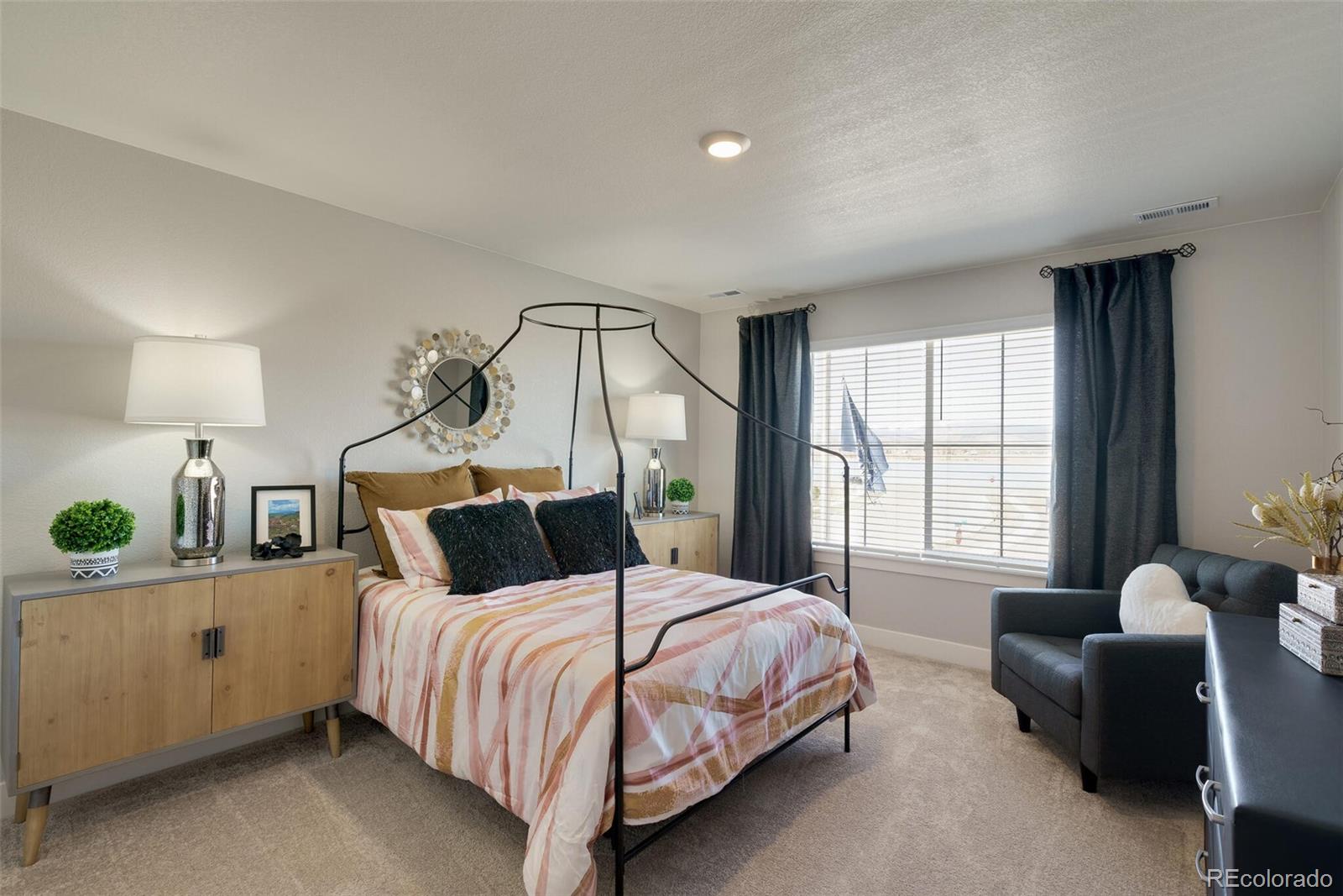 1908 Chaffee Crest Drive Berthoud, CO 80513 - Photo 29 of 39 a bedroom with a bed and a couch