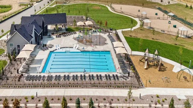 a view of swimming pool with seating area and furniture