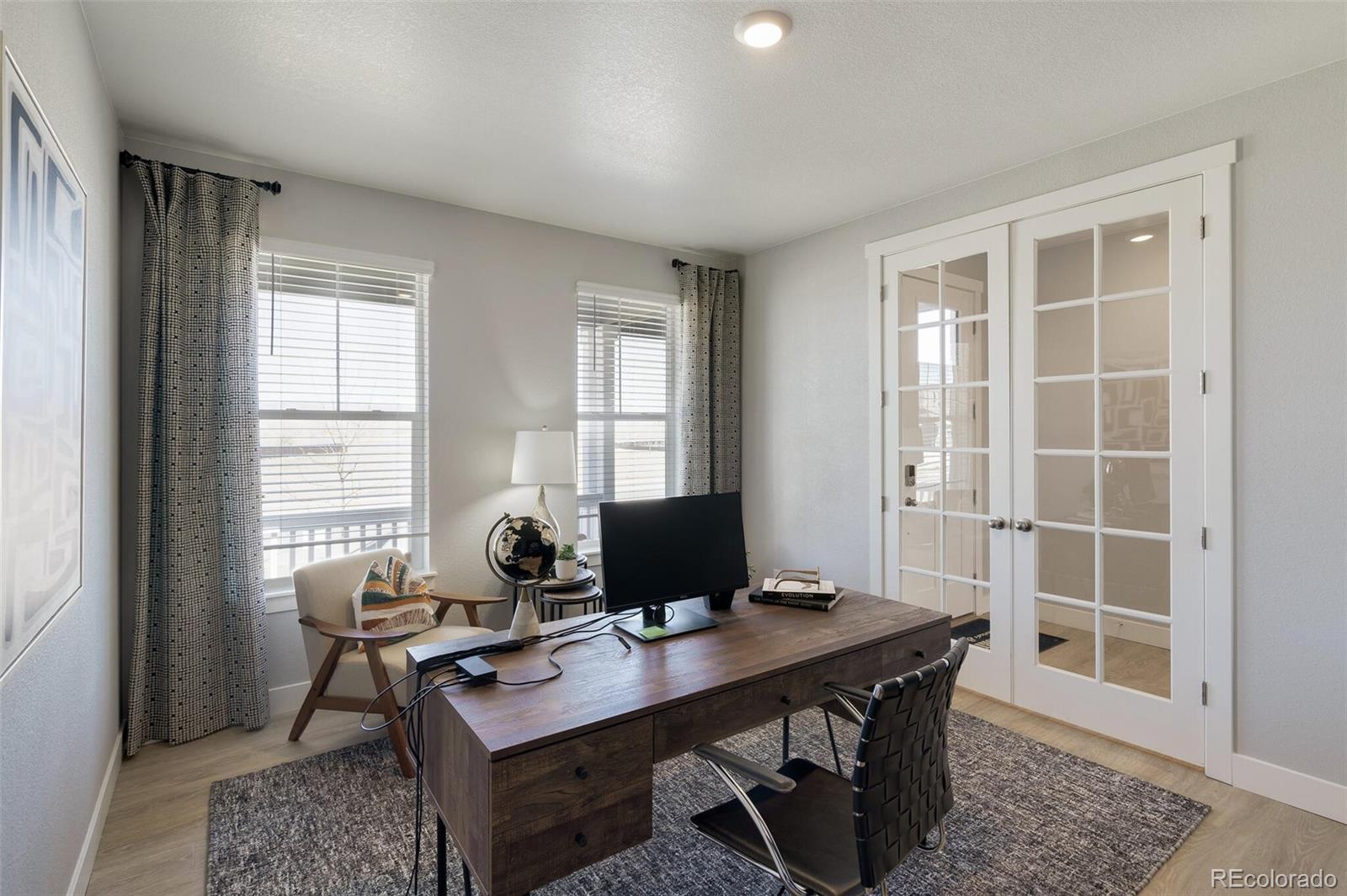 1908 Chaffee Crest Drive Berthoud, CO 80513 - Photo 4 of 39 a view of a workspace with furniture and a window