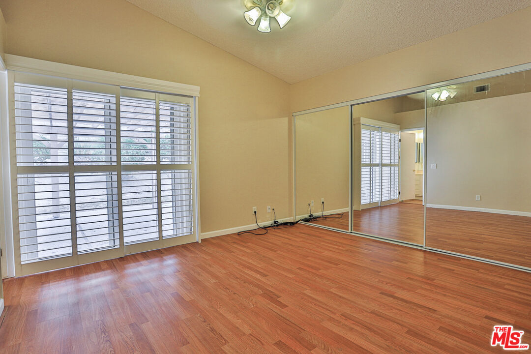 6811 Wilding Place Riverside, CA 92506 - Photo 14 of 42 wooden floor in an empty room with a window
