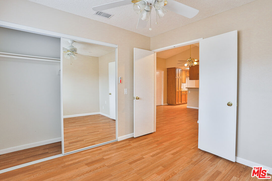 6811 Wilding Place Riverside, CA 92506 - Photo 23 of 42 a view of empty room with wooden floor