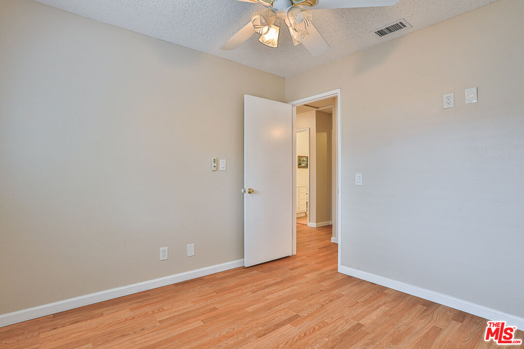 6811 Wilding Place Riverside, CA 92506 - Photo 26 of 42 a view of an empty room with wooden floor