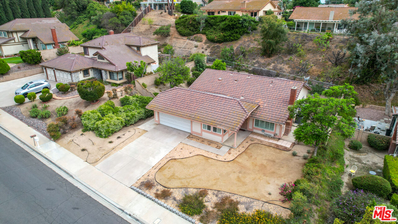 6811 Wilding Place Riverside, CA 92506 - Photo 39 of 42 an aerial view of multiple houses with yard