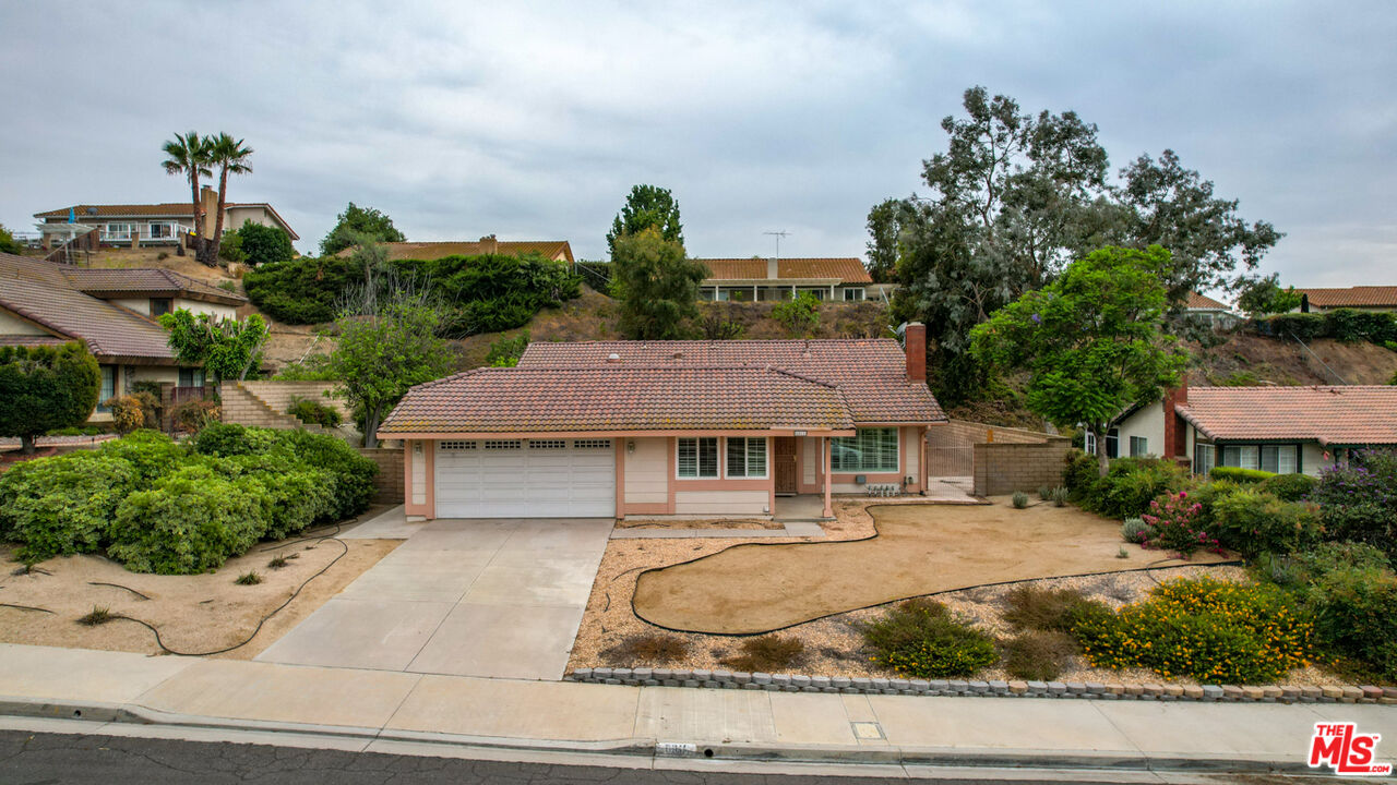 6811 Wilding Place Riverside, CA 92506 - Photo 41 of 42 a house view with a garden space
