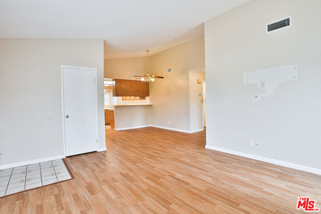 6811 Wilding Place Riverside, CA 92506 - Photo 5 of 42 a view of a kitchen with wooden floor and a sink