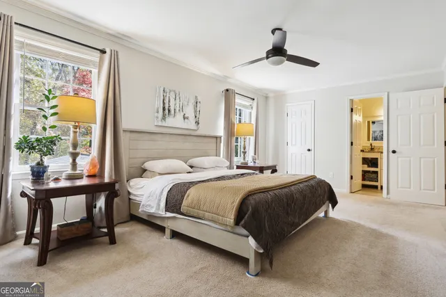 a spacious bedroom with a bed and a table