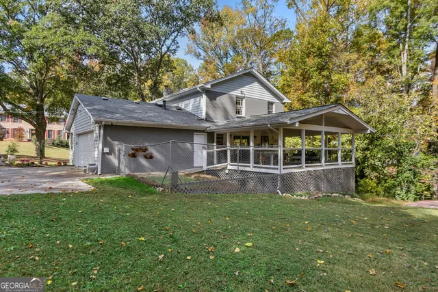 a front view of a house with a yard and porch