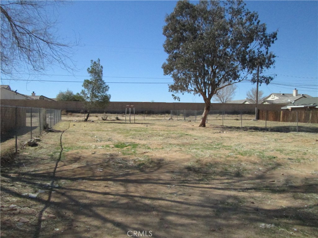 13464 Mohawk Road Apple Valley, CA 92308 - Photo 34 of 35 a view of a yard with an outdoor space