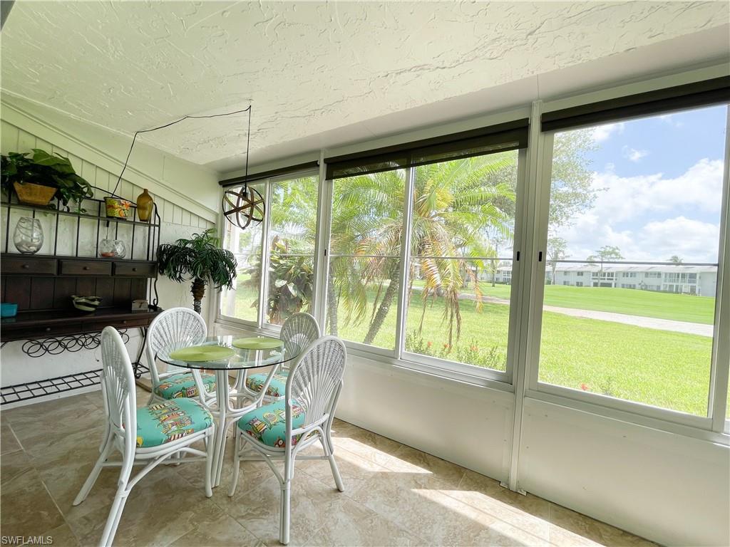 189 Harrison Road, Unit 111 Naples, FL 34112 - Photo 15 of 29 Dine al fresco on the lanai