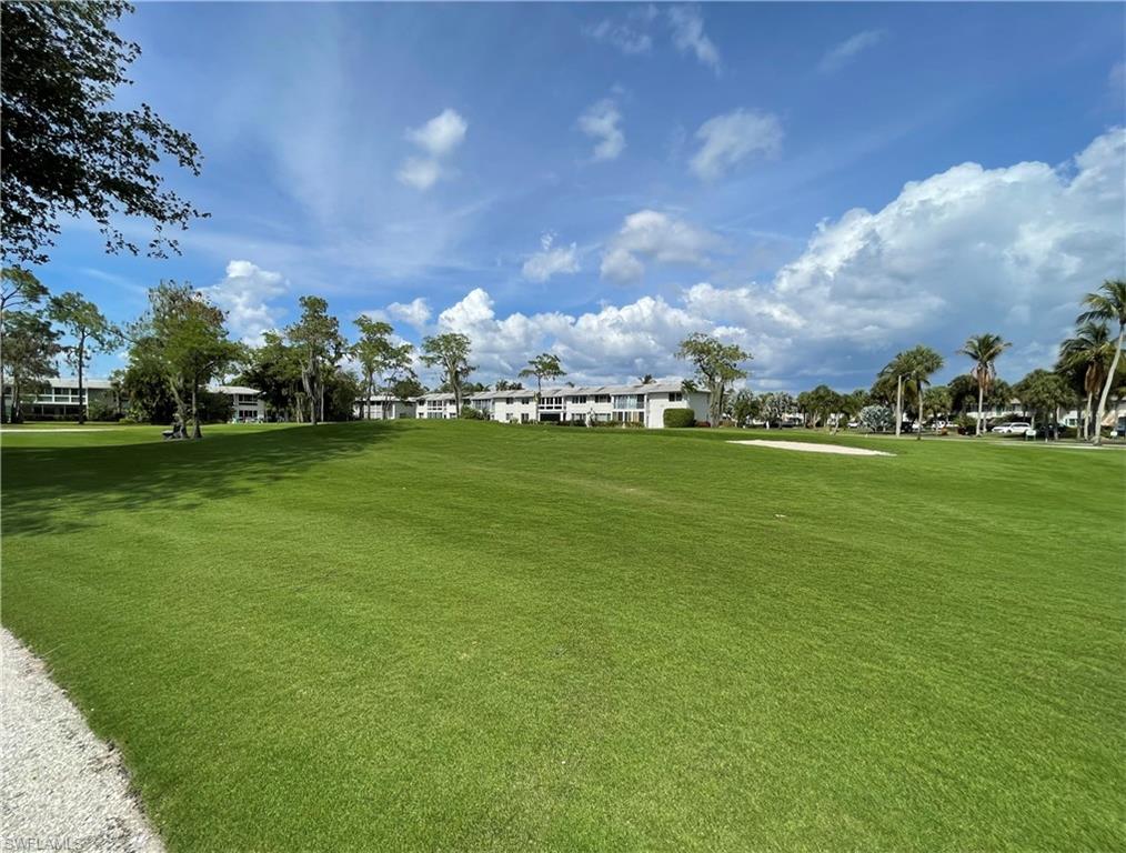 189 Harrison Road, Unit 111 Naples, FL 34112 - Photo 21 of 29 View from the rear out to the Pines 18-hole par 70 course