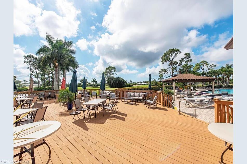 189 Harrison Road, Unit 111 Naples, FL 34112 - Photo 24 of 29 Deck overlooking the pool and golf course