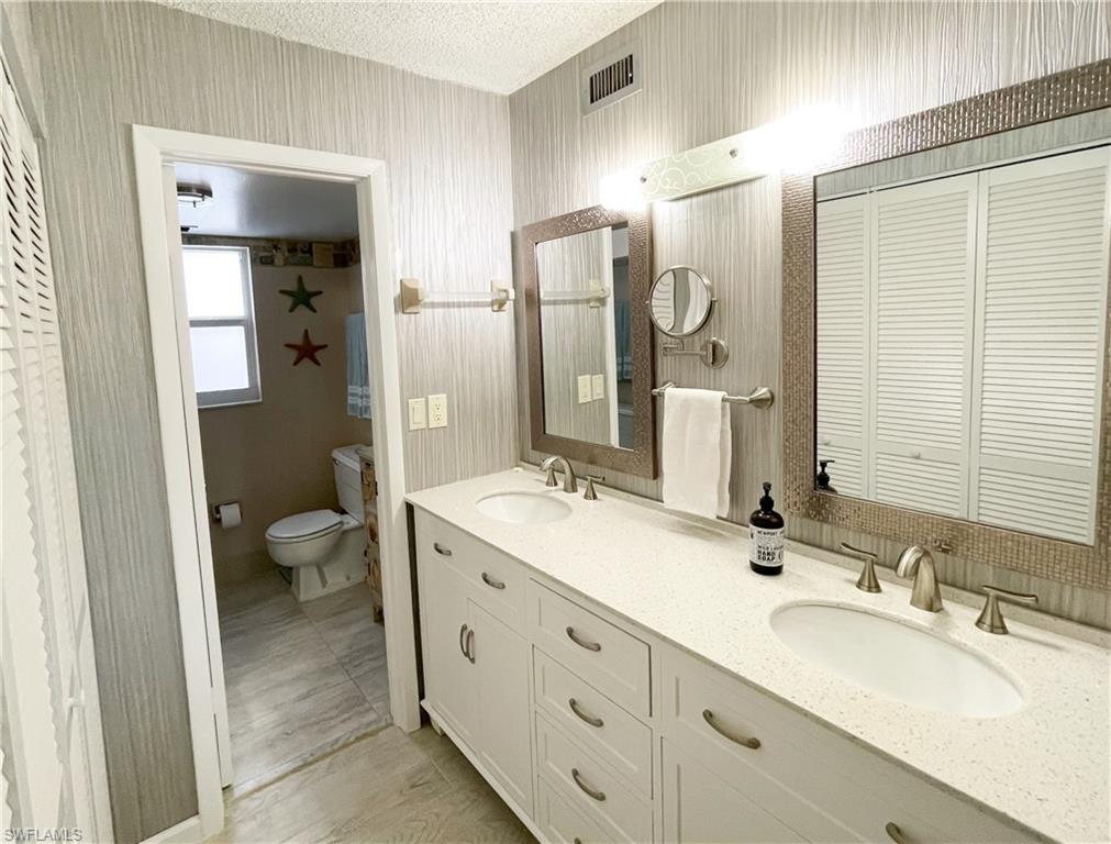 189 Harrison Road, Unit 111 Naples, FL 34112 - Photo 10 of 29 Renovated bathroom with quartz counter