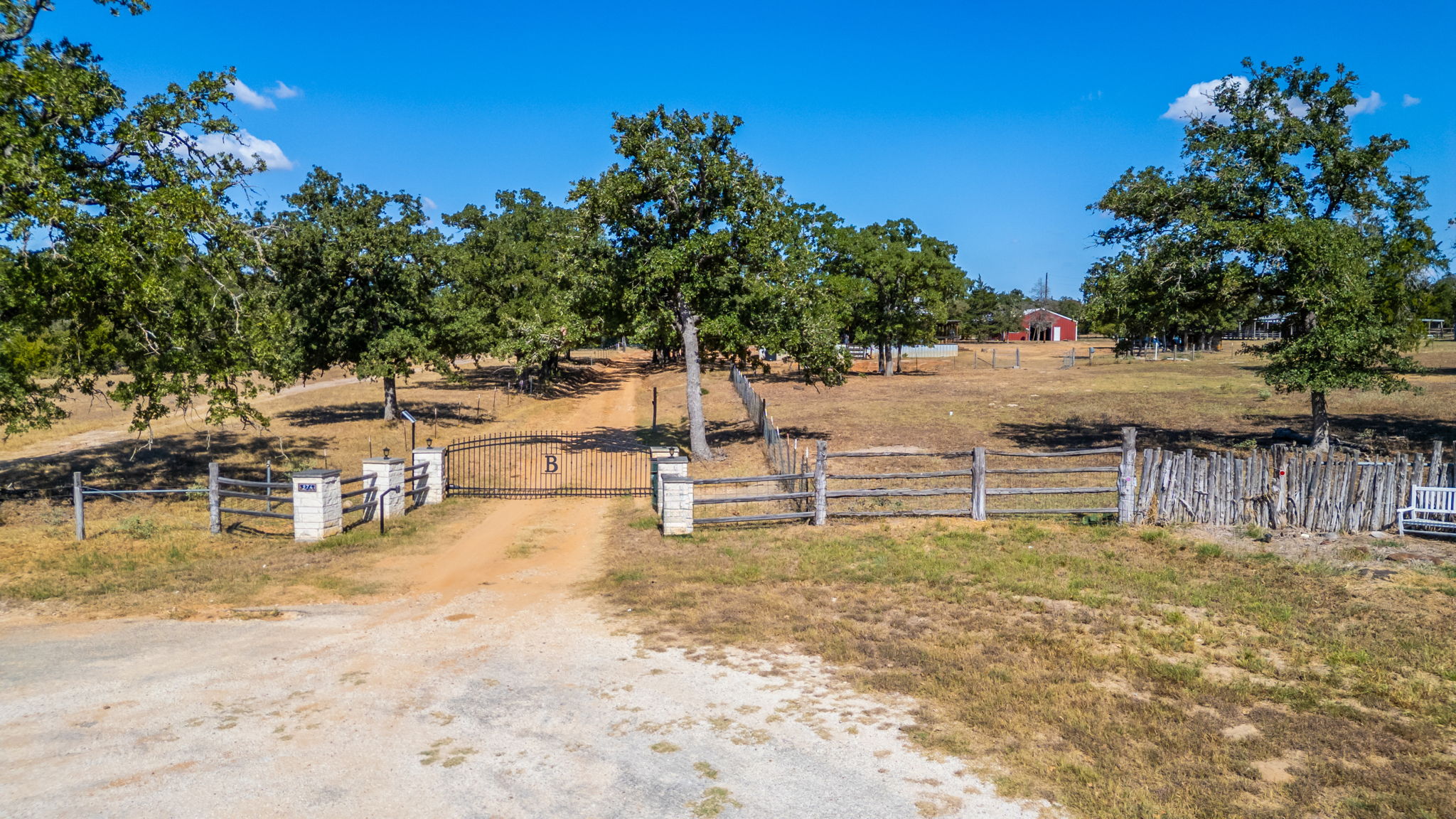 274 Old Potato Road Paige, TX 78659 - Photo 36 of 39 View of yard featuring a gate and a view of rural / pastoral area