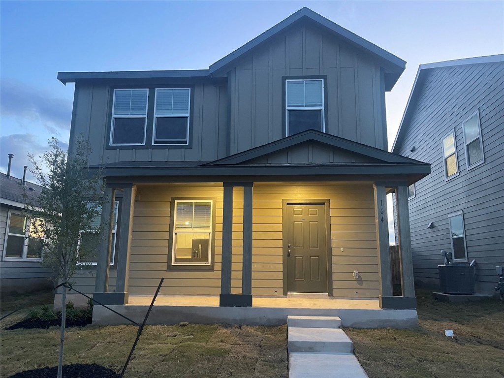 164 Sormonne Loop Kyle, TX 78640 - Photo 1 of 3 a front view of a house with a glass door