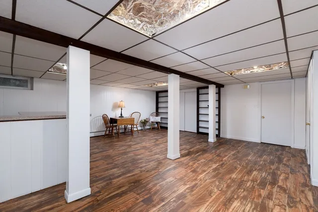 a view of a livingroom with furniture and an empty room