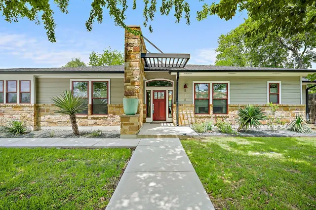front view of a house with a yard