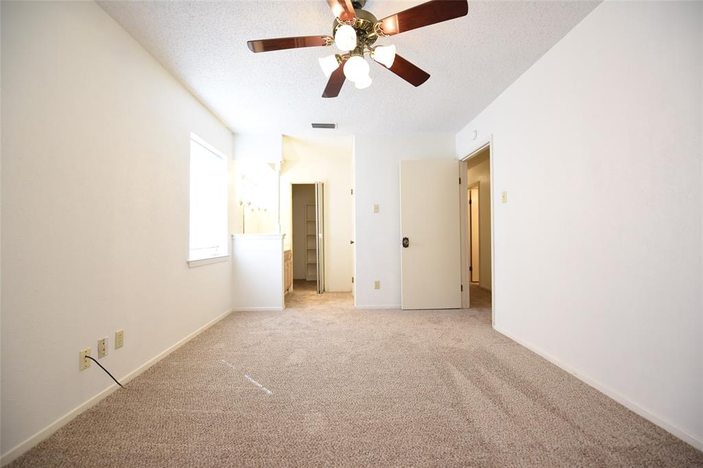 8945 Flicker Lane Dallas, TX 75238 - Photo 14 of 18 a view of empty room with ceiling fan