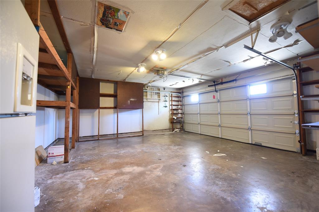 8945 Flicker Lane Dallas, TX 75238 - Photo 16 of 18 a view of a garage