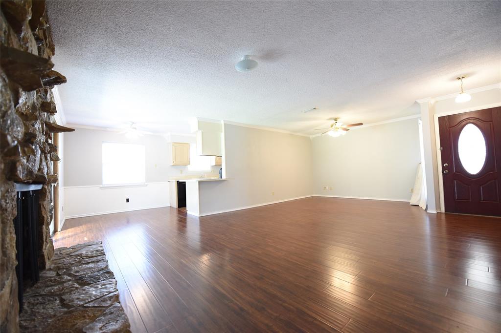 8945 Flicker Lane Dallas, TX 75238 - Photo 3 of 18 a view of empty room with wooden floor