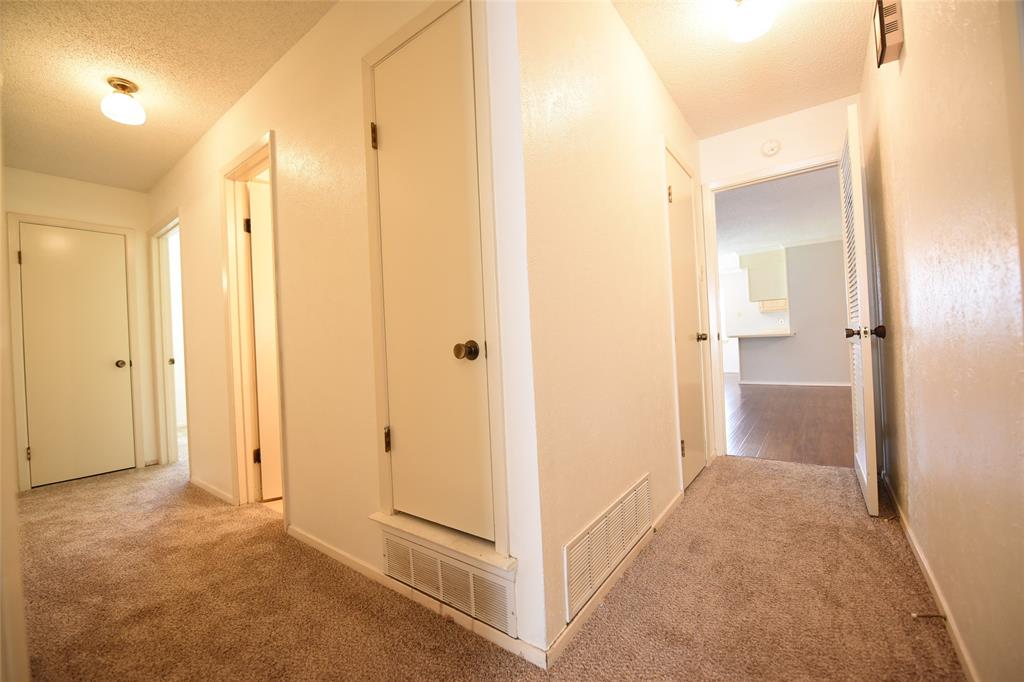 8945 Flicker Lane Dallas, TX 75238 - Photo 8 of 18 a view of a bathroom with a shower and a sink