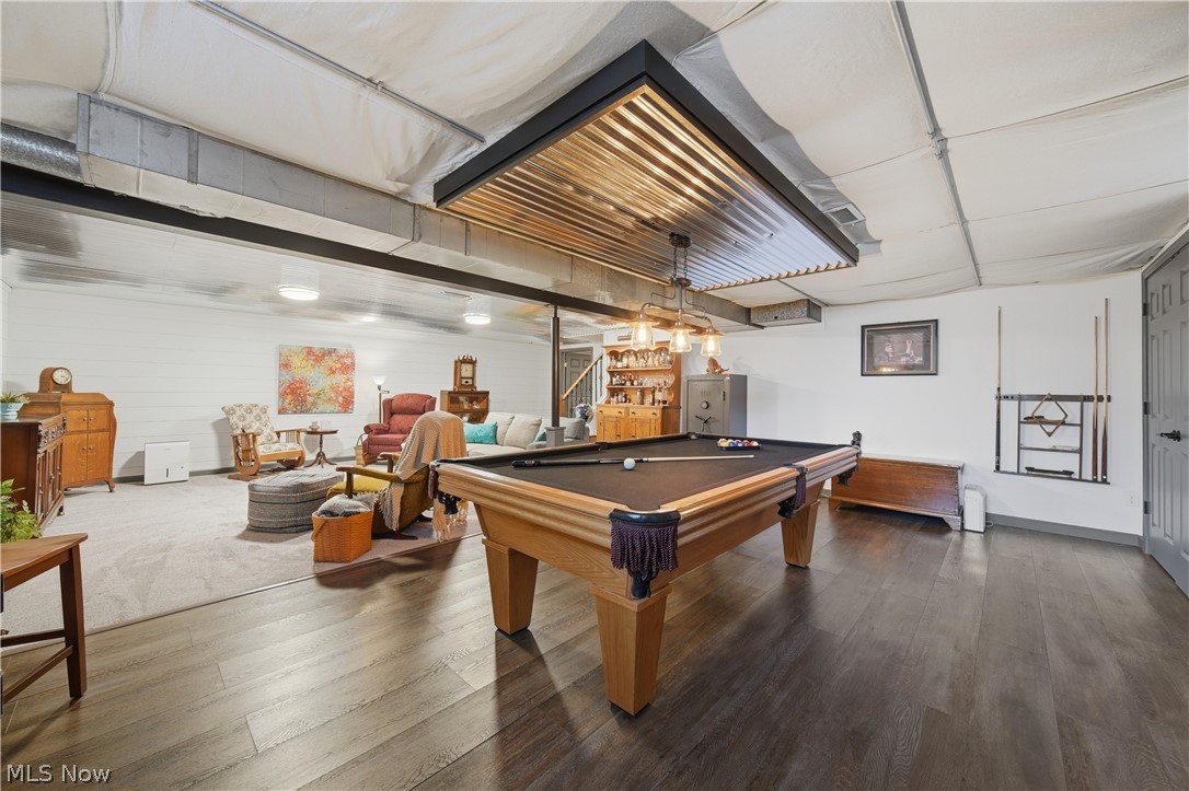 118 Manning Road Mogadore, OH 44260 - Photo 21 of 45 Finished lower level featuring a pool table area with wood-finish flooring, a corrugated metal ceiling accent, and recessed lighting