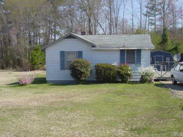 3410 Darroch Road Lillington, NC 27546 - Photo 1 of 1 a front view of a house with garden