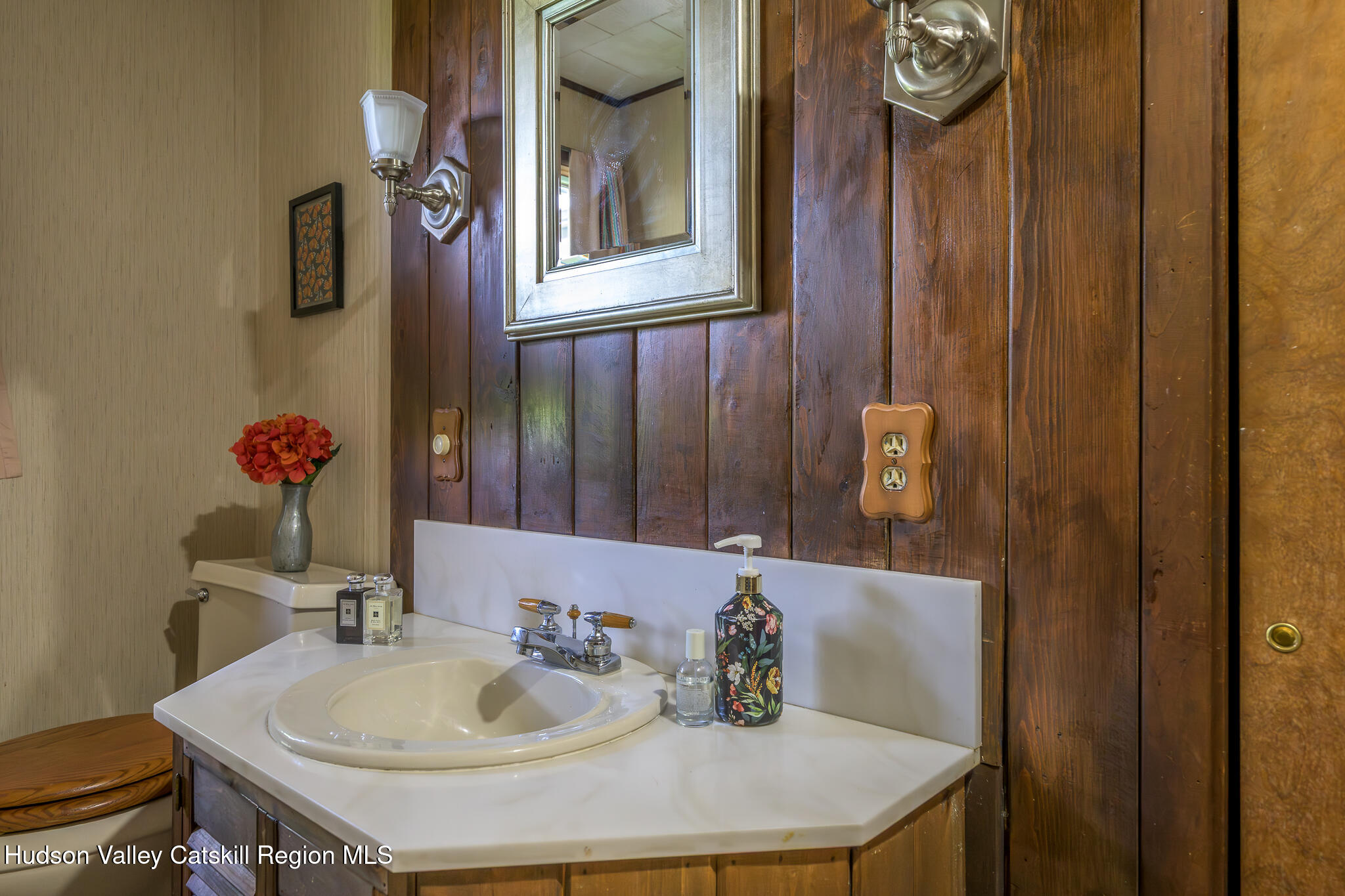 29 Edgemere Hill Road Catskill, NY 12414 - Photo 22 of 38 a bathroom with a sink and a mirror