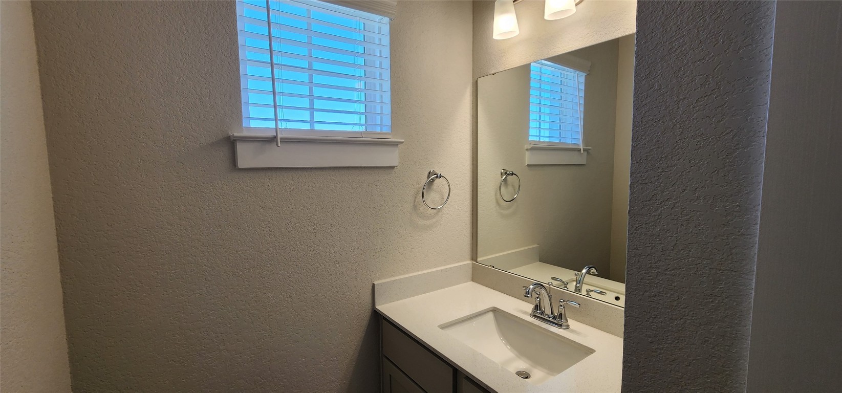 2220 Delano Drive Leander, TX 78641 - Photo 30 of 37 a bathroom with a sink toilet and vanity