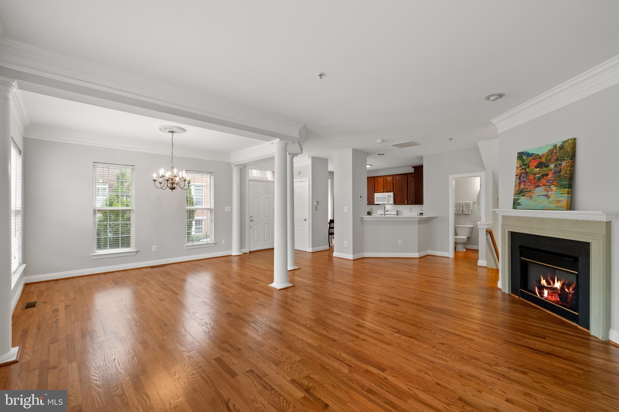 5117 Grimm Drive Alexandria, VA 22304 - Photo 11 of 67 a view of an empty room with wooden floor fireplace and a window